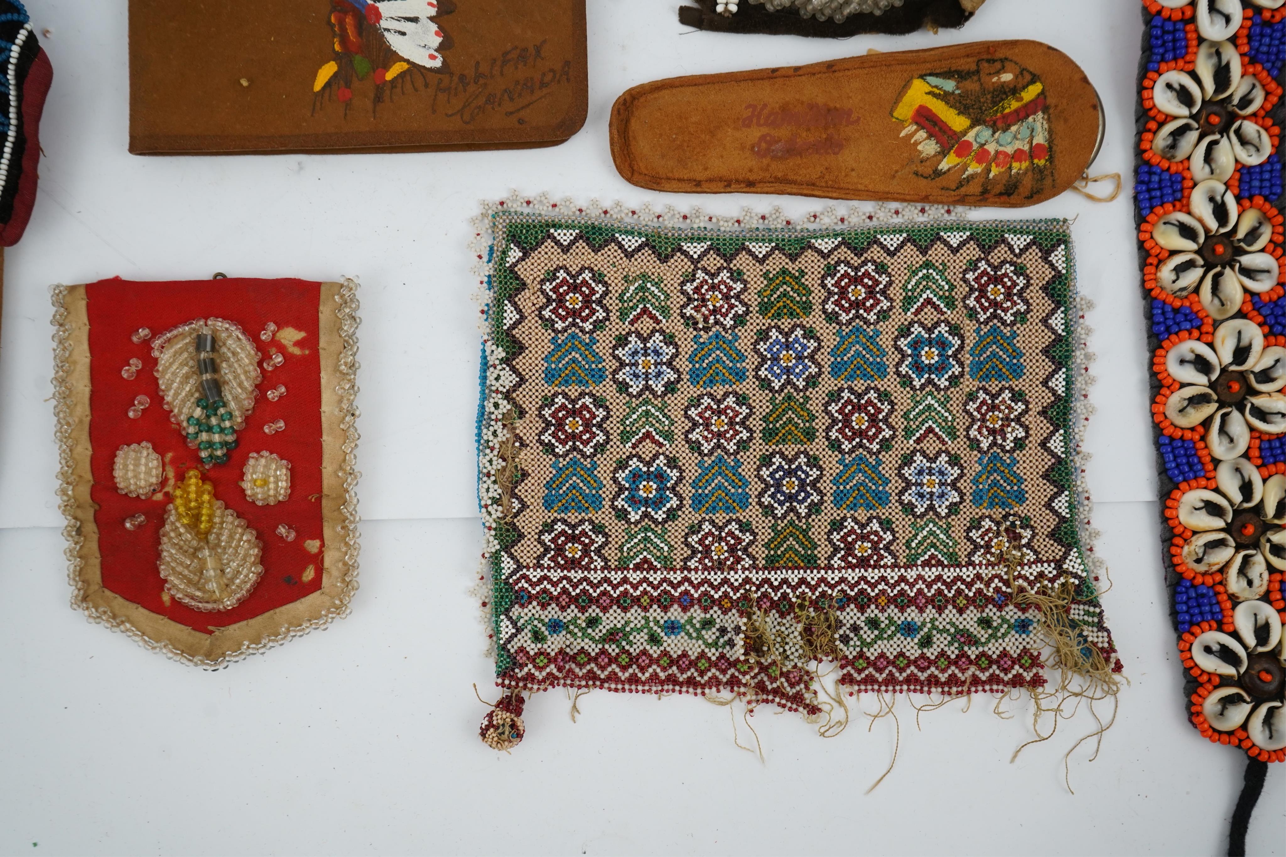 A collection of mixed decorative bead work, including five items of Native American beadwork, together with an early beadwork bag and later beaded items. Condition - moccasins, bead panel, circular bed purse with metal l